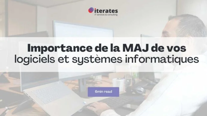 Un homme est assis à un bureau devant plusieurs écrans d'ordinateur. Un titre au-dessus de l'image indique « Importance de la MAJ de vos logiciels et systèmes informatiques » avec un sous-titre « 6 minutes de lecture ». Le logo « iterates IT services & consulting » apparaît en haut.